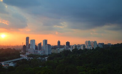 Fototapeta na wymiar View from singapore cable car, aerial view of singapore city near harbour with beautiful sunset 