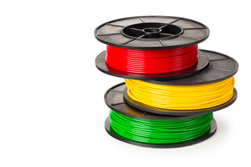 red, green, yellow filament for 3d printer isolated on white background - obrazy, fototapety, plakaty