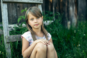 Portrait of a little girl in the village.