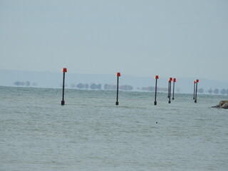 Bollards protruding from the sea