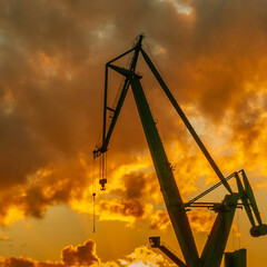 port cranes in gdansk at sunset