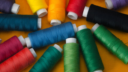 Multi-Colored bobbins of thread. Close up.