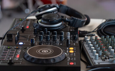 Fototapeta na wymiar headphones are on the remote DJ, close-up