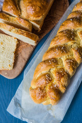 Homemade yeast braided breads on dark background.