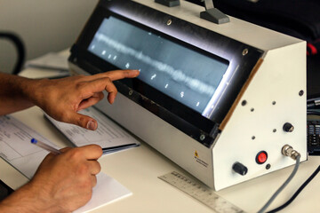 The inspector evaluation radiography of the weld metal with x-ray film viewer box. Industrial...