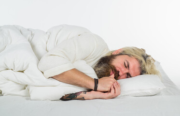 Happy to Sleep. Bearded man sleep in bed. Bearded man in bed. Morning and wake up. Man sleeping in comfortable bed at home. Man sleeping on white bed.