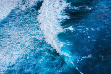 Fototapeta na wymiar Waves as a background. Blue water background from top view. Sea and beach. Seacape from drone. Bali, Indonesia. Travel - image