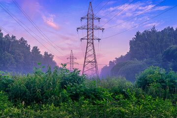 Obraz premium Power transmission lines in the summer in the early beautiful morning at dawn 