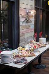 Buffet table of various snacks at the event. Ready meals from catering for the holidays
