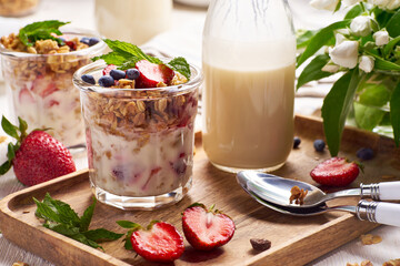 Fresh summer dessert with granola and berries