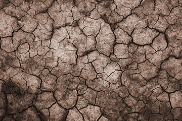 Dry and cracked soil ground during drought, viewed from above - 363371518