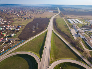 Aerial Top View of highway intersection junction summer morning with car