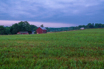 Moody farm view at Mohonk, New York featuring meadow on the foreground