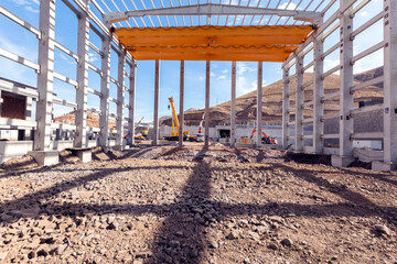 View of the prefabricated (precast) reinforced concrete industrial building from inside . The...