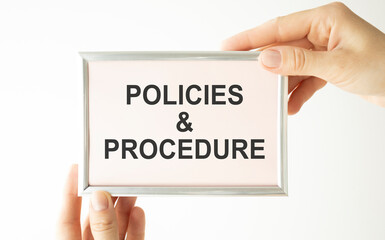 Policies and Procedures text written on a notebook