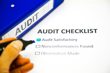 Audit checklist, with tick against "audit satisfactory",