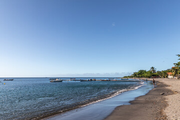 Fototapeta na wymiar Black sand beach in Saint-Pierre, Martinique, France
