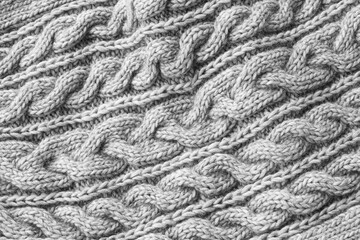 Gray knitted texture. Handmade Knitwear. Background