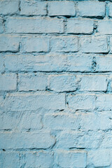 blue painted brick wall shot perpendicularly close up