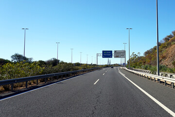 Fototapeta premium sign on freeway showing the direction to Portugal 