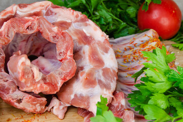 raw pork ribs on a wooden board