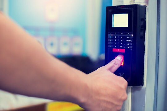 Staff push down electronic control machine with finger scan to access the door of control room or data center. The concept of data security or data access control.