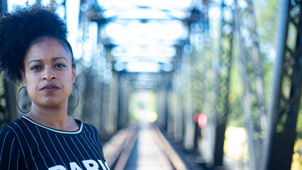 woman walking on railway bridge