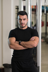 Fototapeta na wymiar Portrait Of Caucasian Instructor In Fitness Center Gym