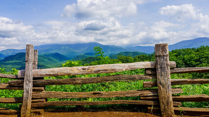 old wooden fence with mountains beyond