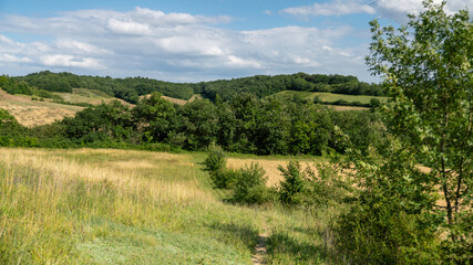 
Walk in the wooded hills, dotted with fields