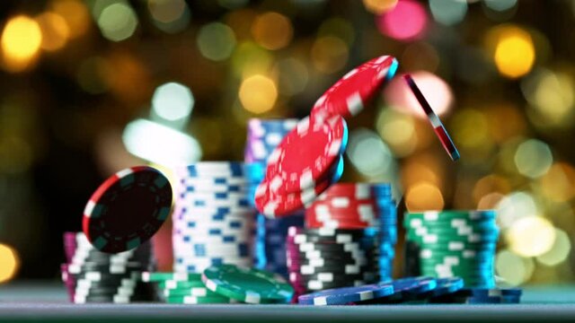 Poker chips falling on casino table in super slow motion, filmed on high speed cinema camera at 1000 fps. Gambling background.