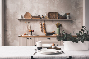 Served table, ready for breakfast. Copyspace for text. Concept of breakfast, old italian kitchen on background.