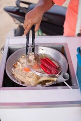 philippine street food tempura and fishballs on a side car market stall