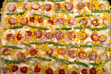 Homemade pizza with ham, tomato, pepper, mushroom, cheese and corn