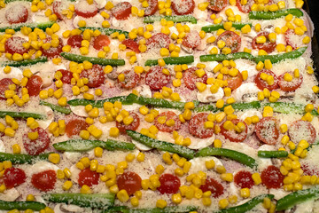 Homemade pizza with ham, tomato, pepper, mushroom, cheese and corn