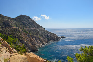Fototapeta na wymiar Ikaria coastline cliff landscape with aegean sea byside