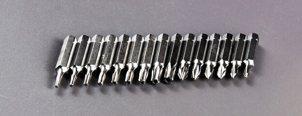 Close-up collection of tough metal bits for screwdriver or drill
