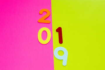 Numbers 2019  on pink and yellow background.