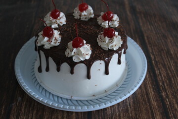 Chocolate pie with whipped cream and cherry
