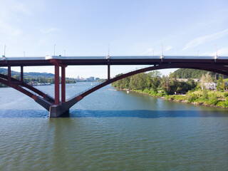 Fototapeta premium Bridge in the city at sunset aerial view.