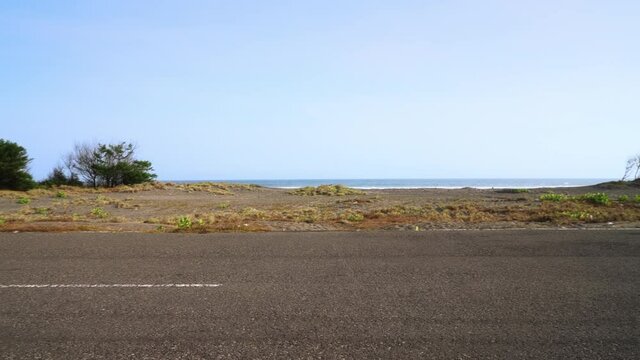 Cool stunt shot as three motorcycle riders cross each other doing front wheelie tricks on an open road.
