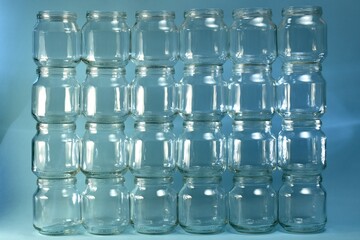 The background, four floors wall, even horizontal rows, is from the built wall of transparent small cans.
