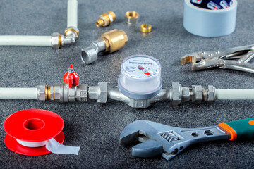 Plumbing tools fittings on concrete structure background. Plumber repairing backgroud.