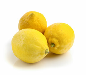 three lemons close-up on a white background, text space, horizontal view