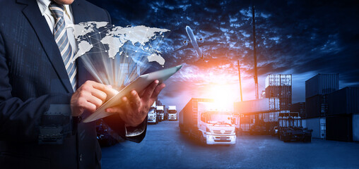 Double exposure image of businessman using a tablet with world map for logistic network distribution on background and Container Cargo freight ship for shipping and Transportation © Travel mania