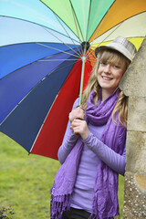 Girl holding a colorful umbrella