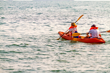 Fototapeta na wymiar Traveler in small boat at beach