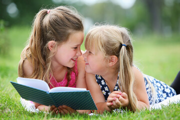 Girls reading a book together