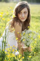 Girl holding a bunch of flowers