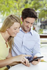 Man and woman reading text message